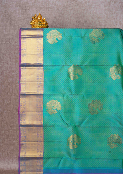 Kanjivaram Sapphire Green Pure Silk Jacquard Saree With Purple Blouse